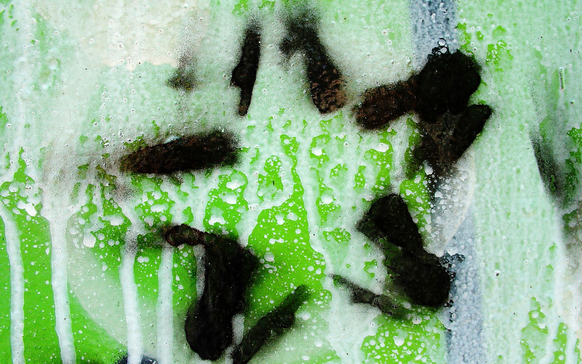 Abstract green CGI fractal HD PC desktop wallpaper — textured colors and shapes: white drips, dark star-like blotches and organic fractal patterns.