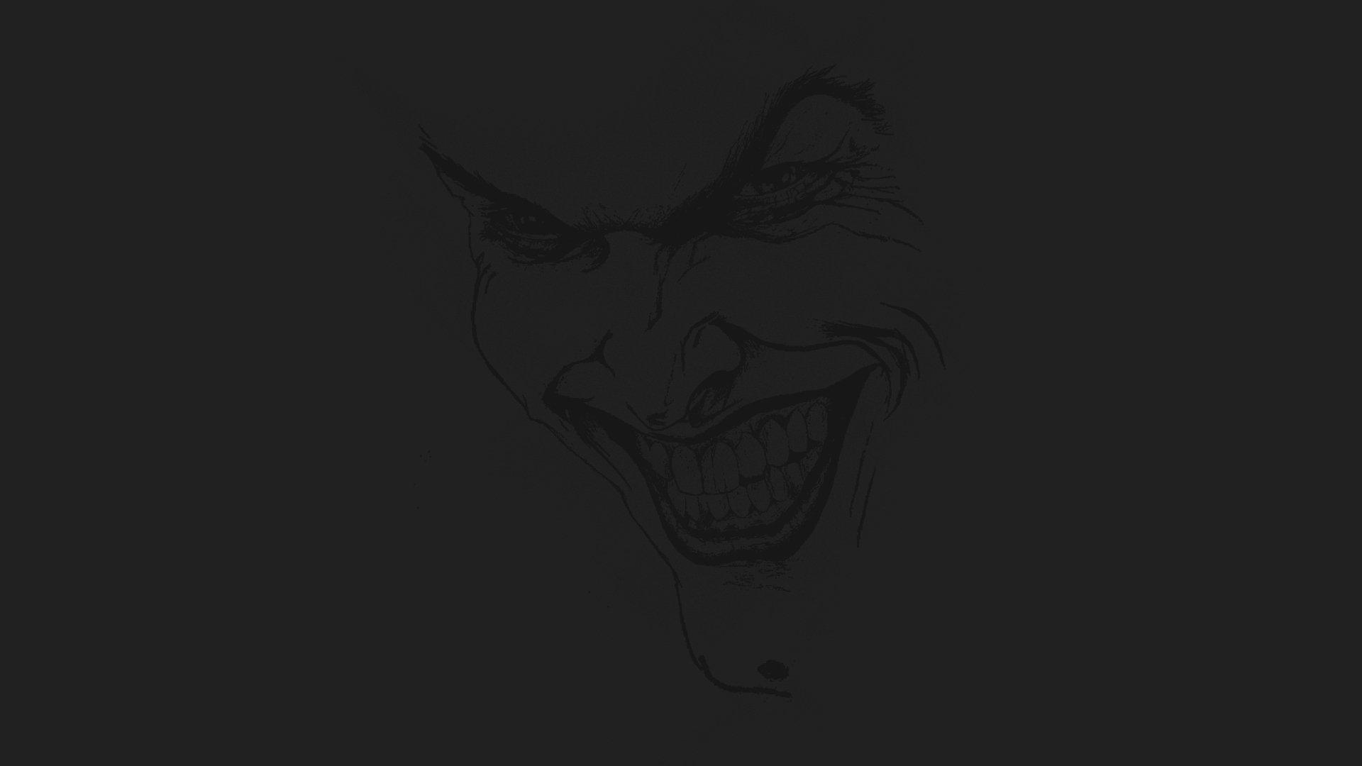 HD PC desktop wallpaper featuring a dark, eerie close-up of the Joker's face from the Batman movie, capturing his sinister smile and intense expression.