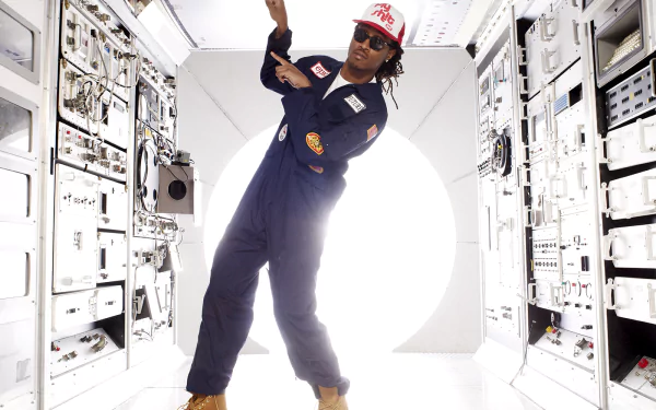 HD wallpaper featuring a rapper in a space-themed outfit posing inside a spaceship corridor, designed for futuristic desktop backgrounds.
