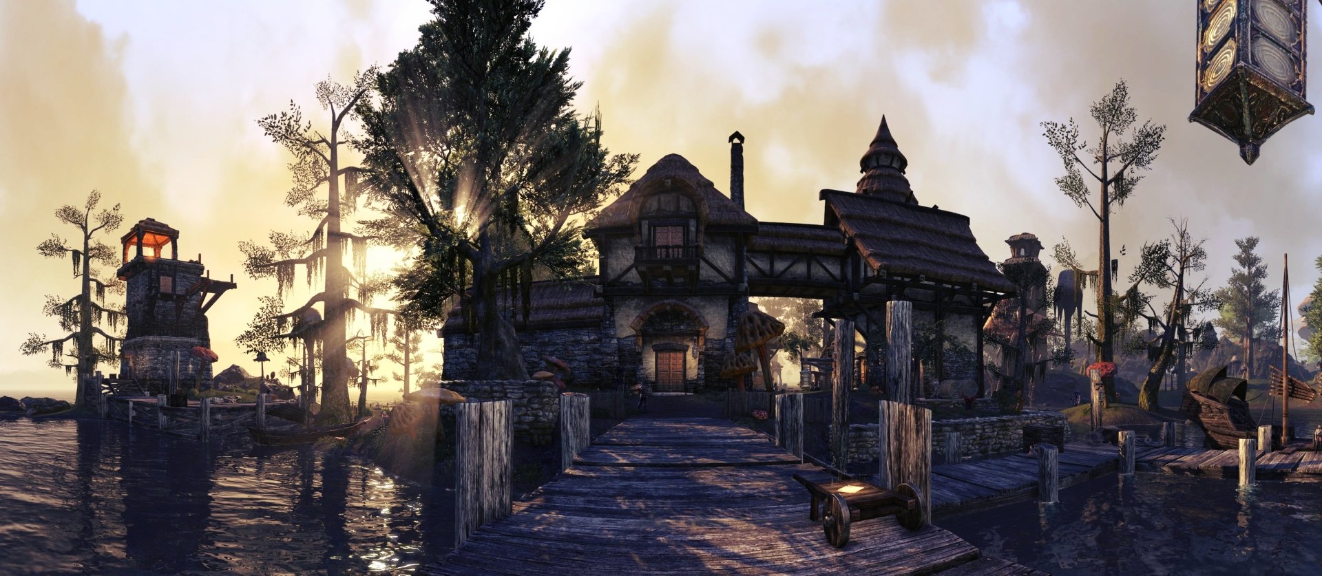 HD PC desktop wallpaper from The Elder Scrolls Online video game, depicting a rustic house at sunset with trees and a wooden walkway over water.
