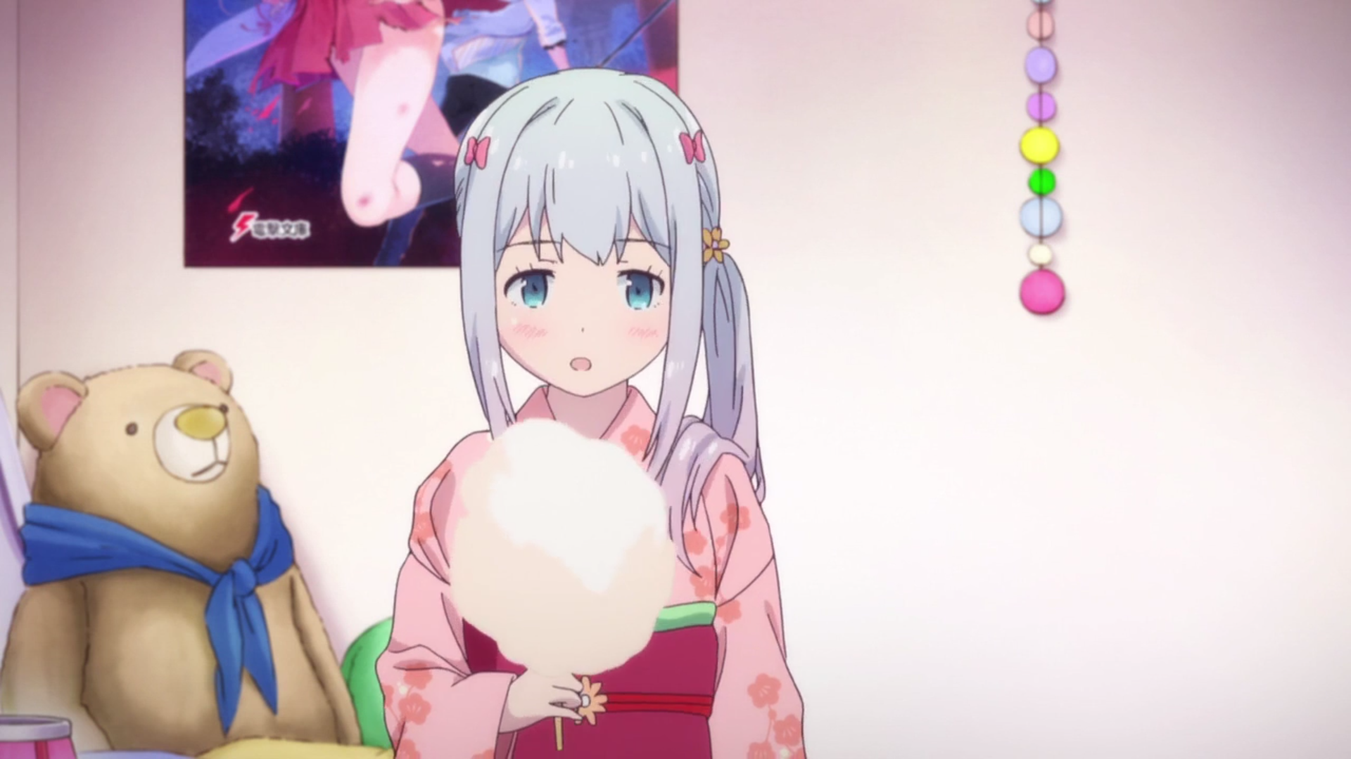 Sagiri Izumi from EroManga-Sensei holds cotton candy in her room, decorated with colorful ornaments and a poster in the background, making for a vibrant anime PC desktop wallpaper.