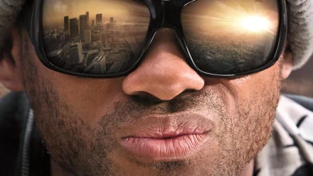 Close-up of Hancock wearing reflective sunglasses showing a city skyline, captured in an HD PC desktop wallpaper for the movie Hancock.