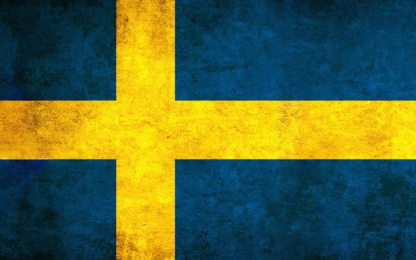A textured HD desktop wallpaper featuring the Flag of Sweden, showcasing a vibrant blue background with a bold yellow Scandinavian cross.