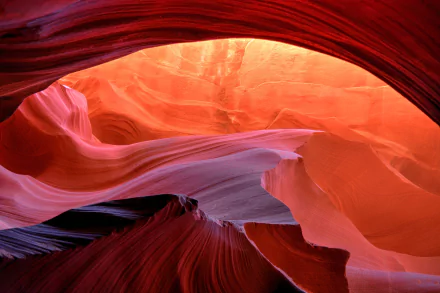 4K Ultra HD image of Antelope Canyon showcasing smooth, flowing red and orange sandstone formations illuminated by natural light.
