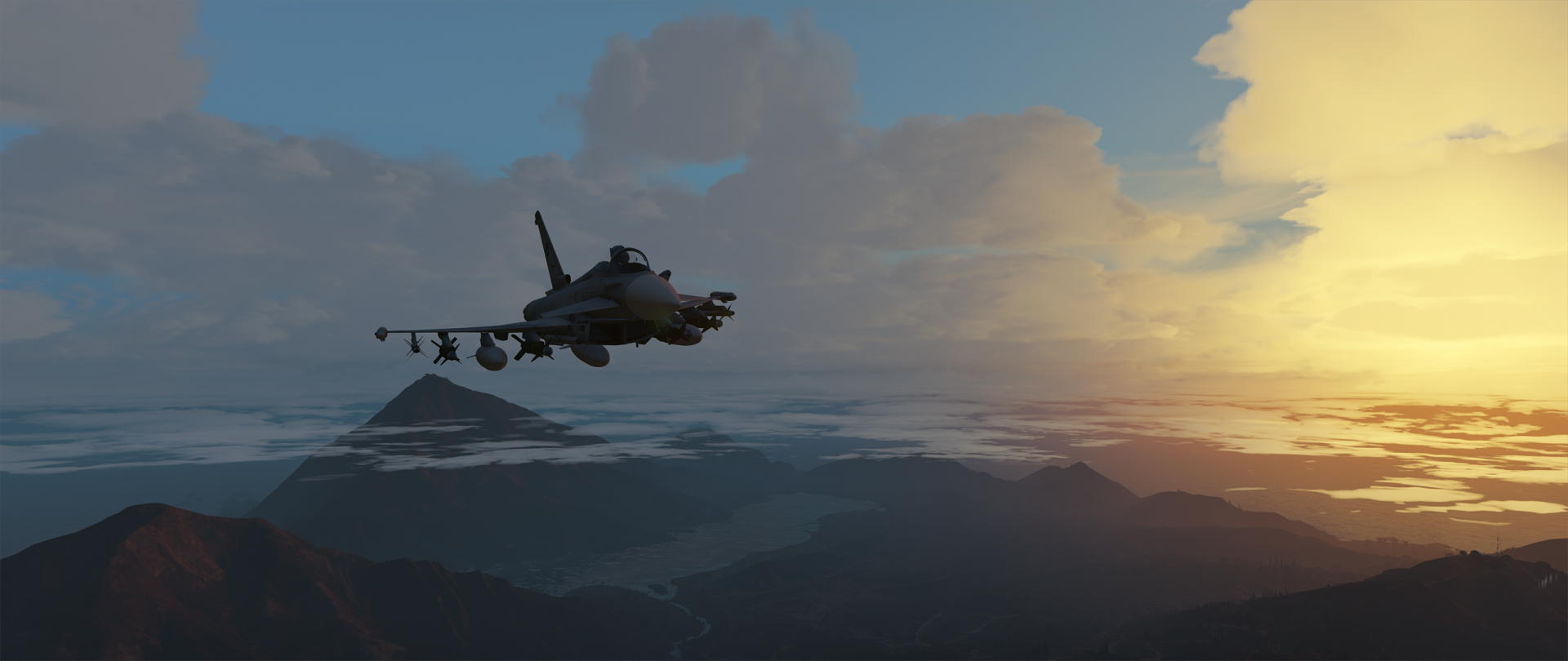 Grand Theft Auto V video game HD PC desktop wallpaper: a fighter jet flies over misty mountains toward a glowing sunset.