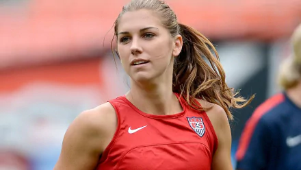 HD wallpaper of a soccer player in a red Nike USA jersey, suitable as a desktop background.