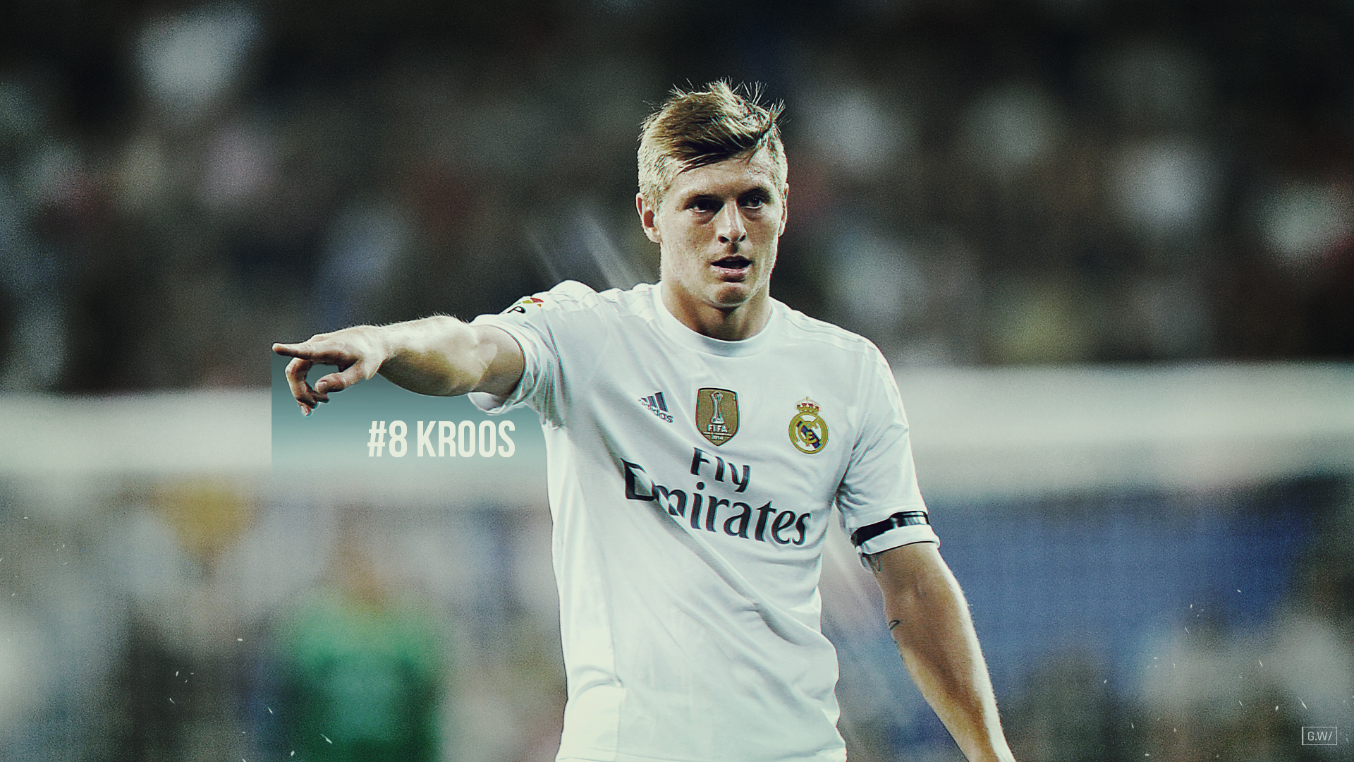 HD wallpaper featuring Real Madrid midfielder Toni Kroos in action during a soccer match.
