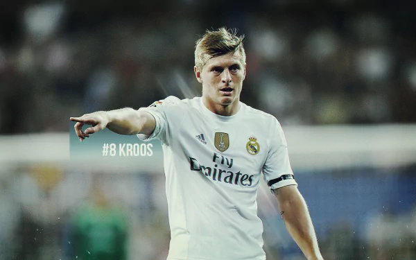 HD wallpaper featuring Real Madrid midfielder Toni Kroos in action during a soccer match.