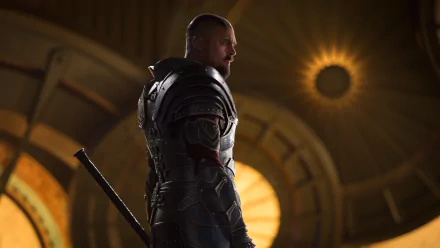 HD desktop wallpaper featuring Karl Urban as Skurge from the movie Thor: Ragnarok. The character is in a dramatic, dimly lit setting with a glowing background.