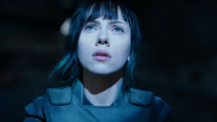 Close-up of a female cyborg with short dark hair and pale skin under blue light, wearing tactical armor — Ghost in the Shell (2017) movie HD PC desktop wallpaper.