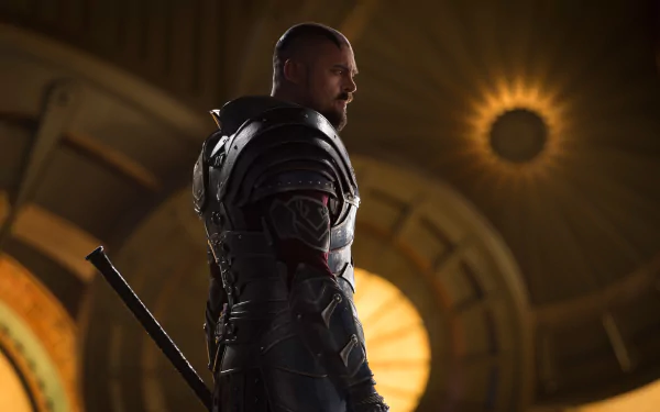 HD desktop wallpaper featuring Karl Urban as Skurge from the movie Thor: Ragnarok. The character is in a dramatic, dimly lit setting with a glowing background.