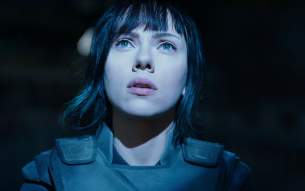 Close-up of a female cyborg with short dark hair and pale skin under blue light, wearing tactical armor — Ghost in the Shell (2017) movie HD PC desktop wallpaper.