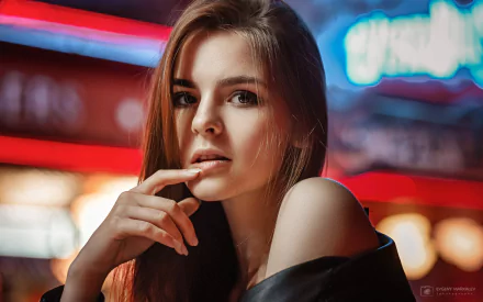 HD desktop wallpaper featuring a brunette woman with brown eyes in sharp focus, set against a vibrant, blurred background with depth of field effects.