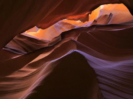 HD PC desktop wallpaper and background of Antelope Canyon: undulating sandstone walls in warm orange and cool purple light, a nature scene of layered rock curves and a narrow canyon sky.