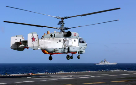 4K Ultra HD wallpaper showcasing a Kamov Ka-27 military helicopter hovering over a ship at sea under a clear blue sky.