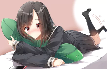 An anime schoolgirl with black hair and red eyes blushes while hugging a green pillow. She is in a school uniform and holding a phone, in an HD desktop wallpaper background.