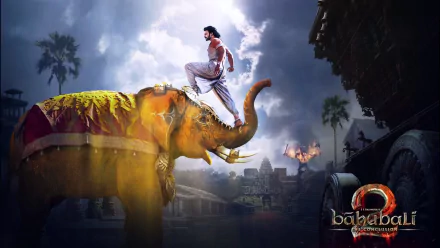 HD wallpaper from Baahubali 2: The Conclusion showing a majestic elephant with a heroic figure atop, set against a dramatic background.
