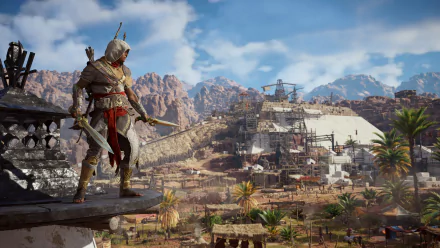 HD desktop wallpaper featuring Bayek Of Siwa from the video game Assassin's Creed Origins, standing on a ledge overlooking a detailed landscape with ancient structures and mountains in the background.
