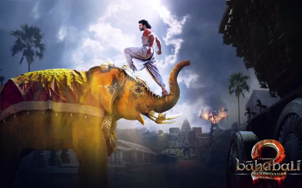 HD wallpaper from Baahubali 2: The Conclusion showing a majestic elephant with a heroic figure atop, set against a dramatic background.