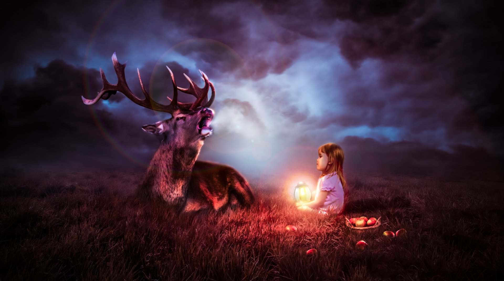 A child holding a glowing lantern sits near a majestic deer under a mystical night sky, with apples scattered nearby in this 4K Ultra HD fantasy desktop wallpaper.