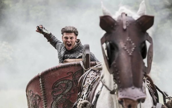Roaring Viking warrior charging on horseback, shield raised amid mist — TV show Vikings (2013) 5K Ultra HD PC desktop wallpaper background.