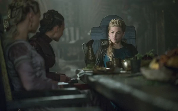 8K desktop wallpaper: blonde shieldmaiden with braided hair sits at a dim longhouse table, tense expression amid candles and wooden feastware.