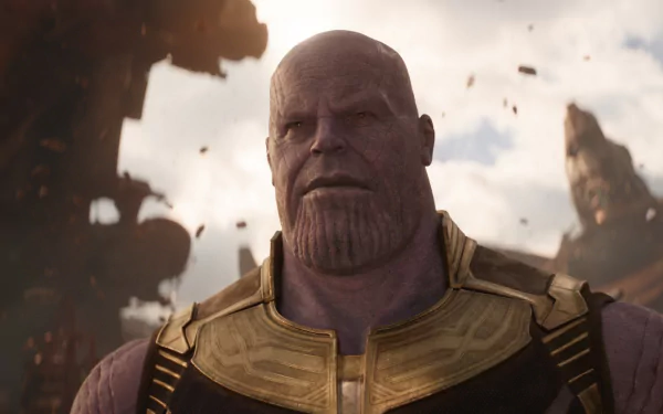 HD desktop wallpaper of Thanos, portrayed by Josh Brolin, from the movie Avengers: Infinity War. The background shows a dramatic, battle-damaged sci-fi landscape.