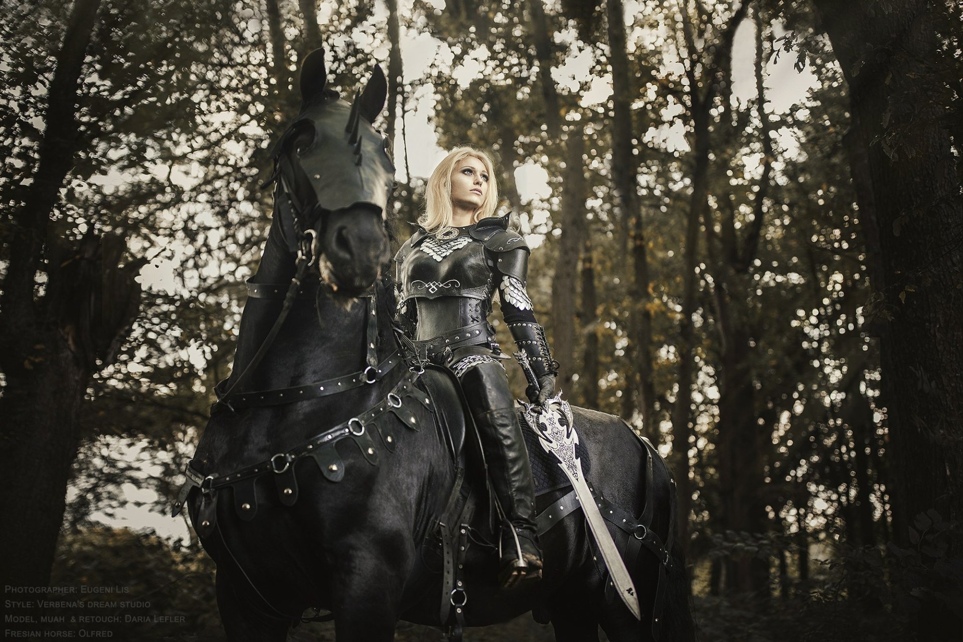 HD desktop wallpaper of a woman in detailed cosplay armor, holding a sword while sitting on a black horse in a forest setting.