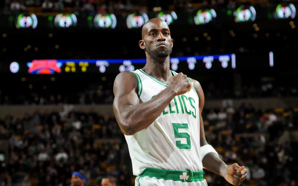 Kevin Garnett in Boston Celtics uniform on a basketball court during an NBA game, captured in a high-definition sports wallpaper background.
