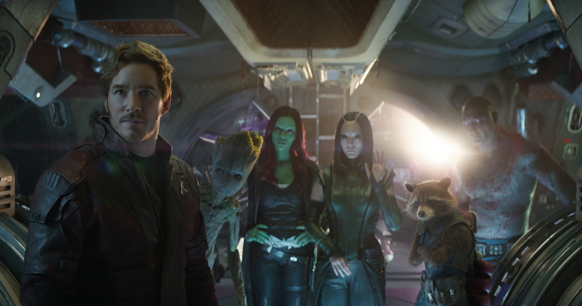 Guardians of the Galaxy characters including Star Lord, Gamora, Rocket Raccoon, Groot, and Drax the Destroyer from Avengers: Infinity War stand together in a spaceship. HD desktop wallpaper background.