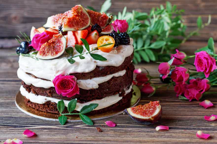 HD PC desktop wallpaper - still life of a rustic layered cake topped with figs, berries and pink roses, surrounded by rose petals and greenery on a wooden background.