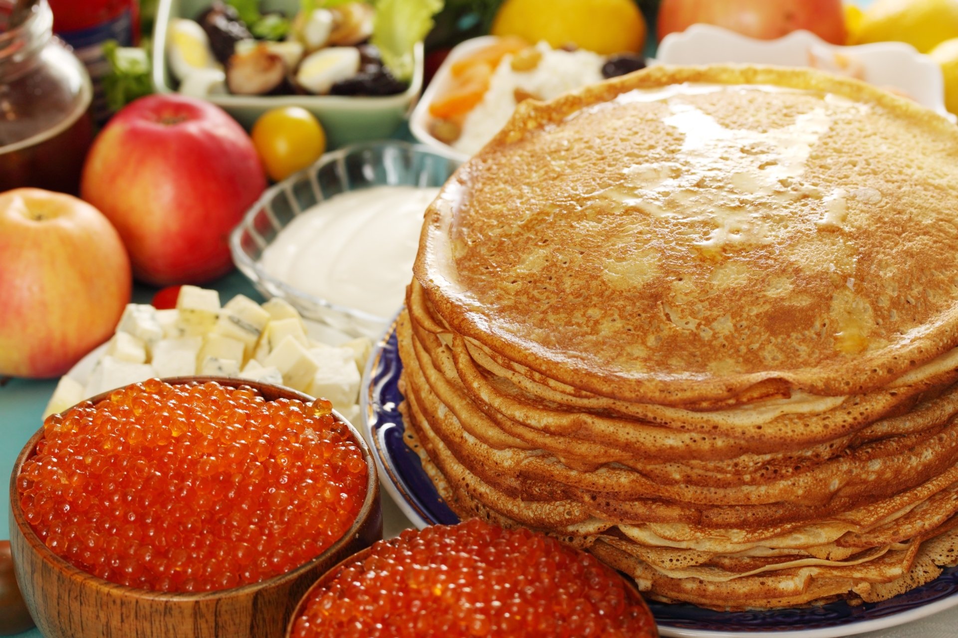 2K Quad HD PC desktop wallpaper and background: still-life of stacked crêpes with bowls of red caviar, fruit, cheese and a dish of sour cream.