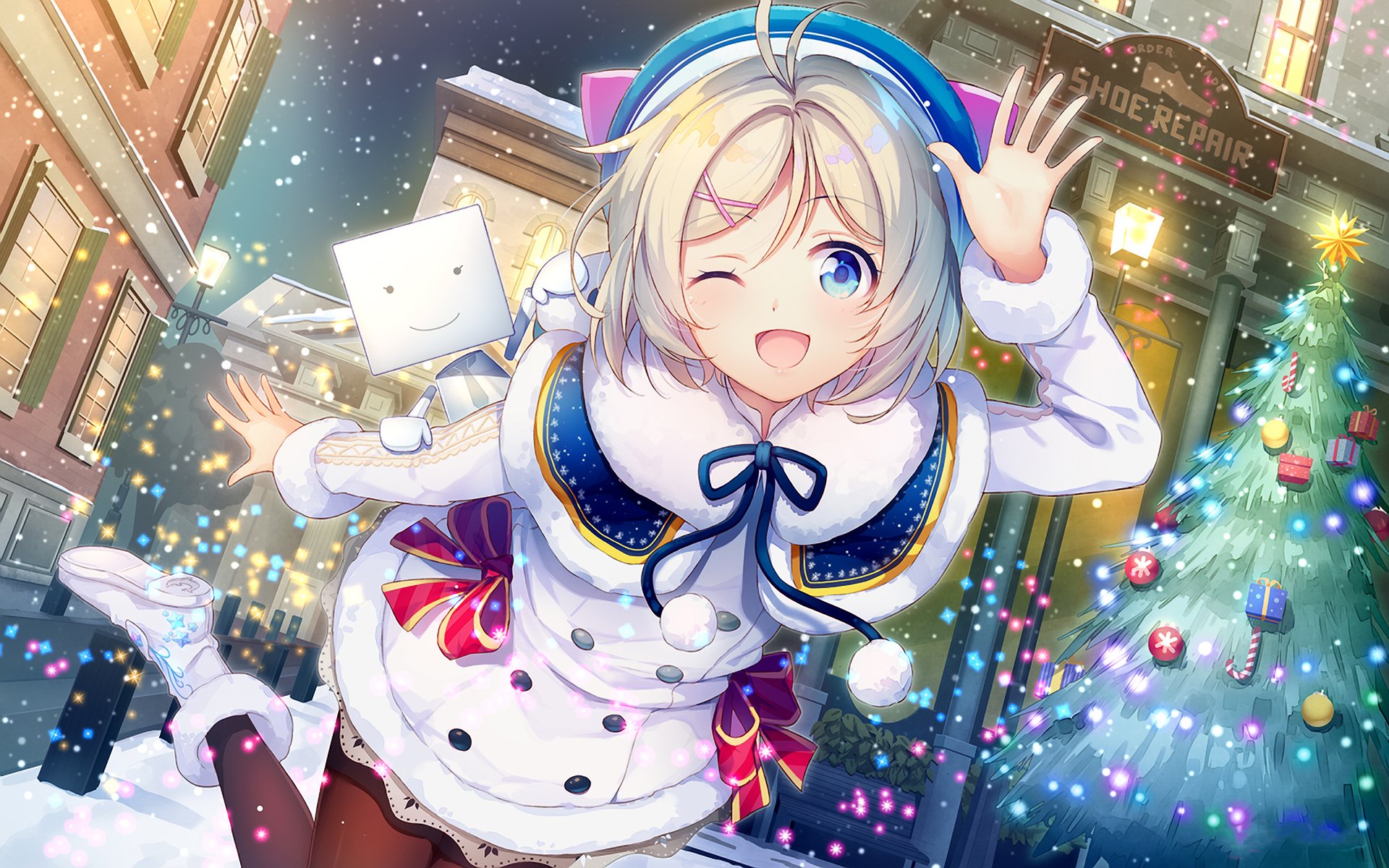 Anime character with short blonde hair and blue eyes winks and smiles, wearing winter clothes and boots, in front of a decorated Christmas tree. A joyful scene from a Vtuber Christmas HD desktop wallpaper.