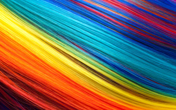 Vibrant 4K Ultra HD abstract desktop wallpaper featuring dynamic, flowing streaks of blue, red, yellow, and orange colors in a colorful, energetic composition.