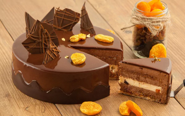HD desktop wallpaper featuring a rich chocolate cake with decorative shards and dried fruit, styled as a still life pastry and food composition.
