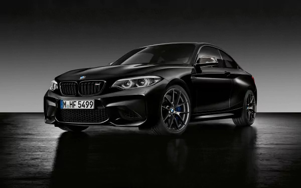 Black BMW M2 sports car showcased in sleek 4K Ultra HD, set against a minimalist dark background, highlighting its bold design and performance features.