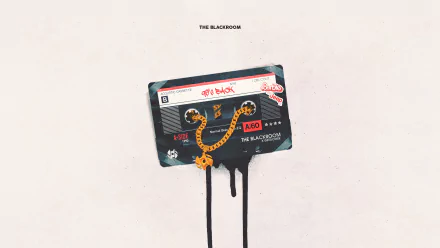 4K Ultra HD PC desktop wallpaper: music cassette — a black vintage tape with a gold smiley-chain pendant and black paint drips on a pale background.