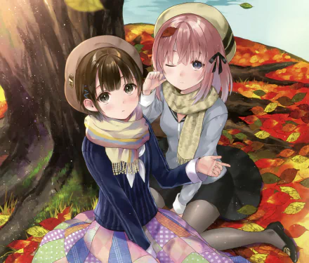 Two short-haired anime girls in hats, scarves and bows sit under a tree on autumn leaves — one brunette with brown eyes, the other blonde with blue eyes, both blushing; HD desktop wallpaper.