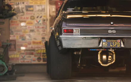 Close-up of a black Chevrolet Nova SS race car with a MR LSPD license plate, captured with depth of field, featured as an HD PC desktop wallpaper and background.