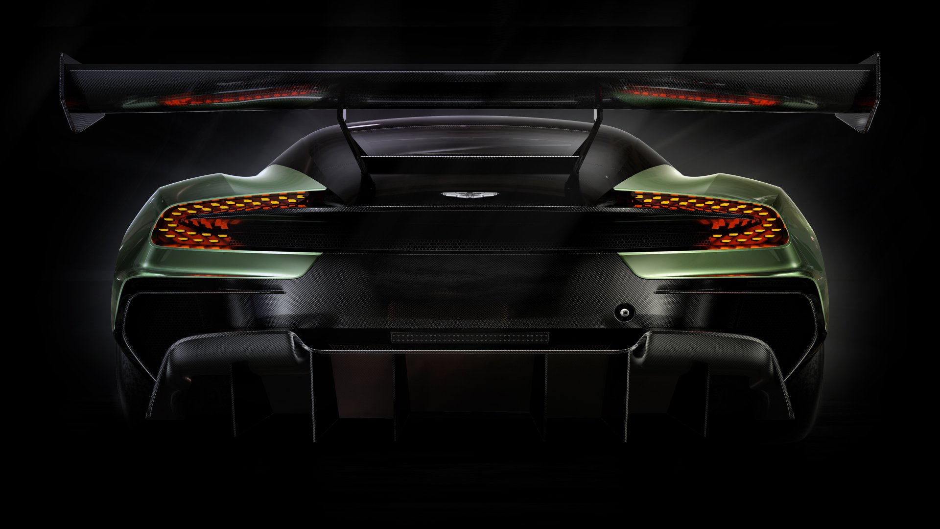 Rear view of a sleek Aston Martin Vulcan hypercar, showcasing its aerodynamic design and race-ready features in stunning 4K Ultra HD resolution.