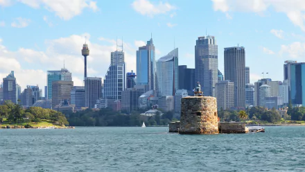 HD desktop wallpaper of Sydney Harbour featuring Fort Denison in the foreground with the city’s skyscrapers and skyline in the background, Australia.
