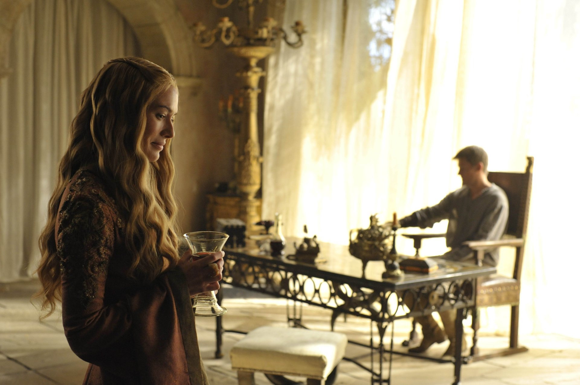 HD PC desktop wallpaper featuring Lena Headey as Cersei Lannister from the TV show Game of Thrones in a dimly lit, elegant room.