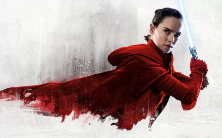 HD desktop wallpaper featuring Daisy Ridley as Rey from Star Wars: The Last Jedi, depicting her in a dynamic pose wielding a blue lightsaber, dressed in a red cloak with a textured white background.