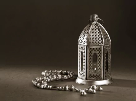 4K Ultra HD PC desktop wallpaper: Islamic religious still life — ornate metal lantern and prayer beads (tasbih) arranged on a muted background.