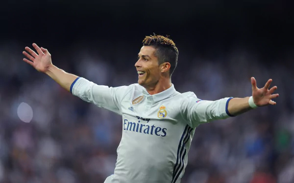 HD desktop wallpaper of Portuguese soccer player Cristiano Ronaldo celebrating on the field.