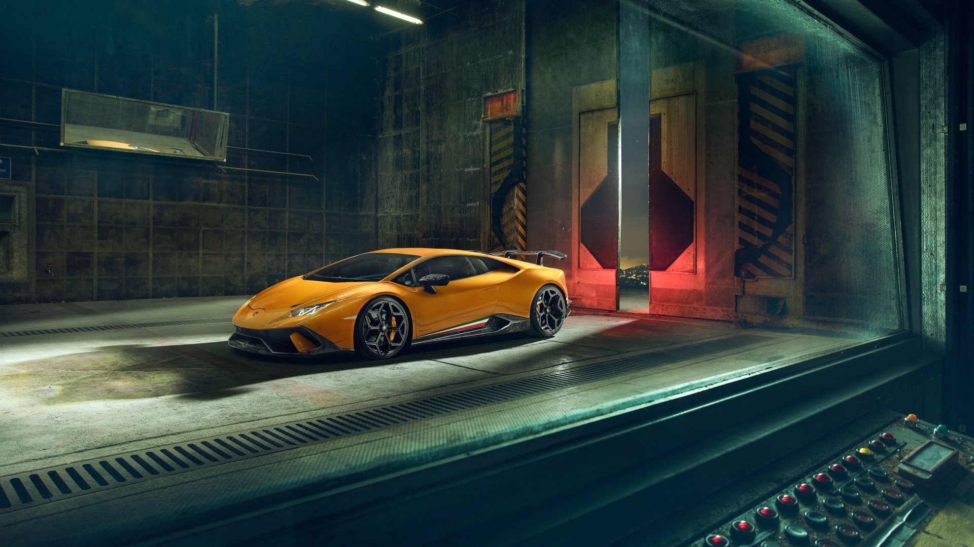A yellow Lamborghini Huracan Performante supercar parked inside an industrial garage, showcased in sharp 4K Ultra HD detail as a PC desktop wallpaper.