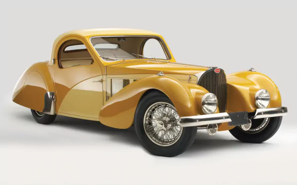A golden Bugatti Type 57 classic vehicle showcased in 4K Ultra HD, displayed as a detailed PC desktop wallpaper and background.