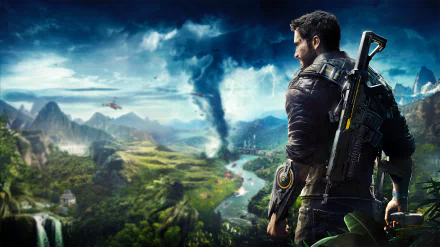 HD desktop wallpaper featuring Rico Rodriguez from the video game Just Cause 4. Rodriguez stands armed, overlooking a vibrant landscape with mountains, a river, and a tornado in the distance.