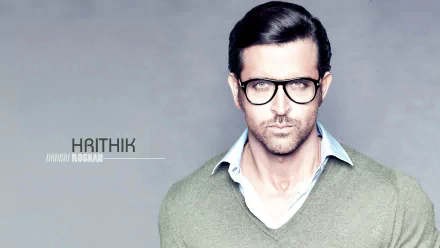 HD desktop wallpaper featuring a portrait of a man captioned with HRITHIK on a grey background.
