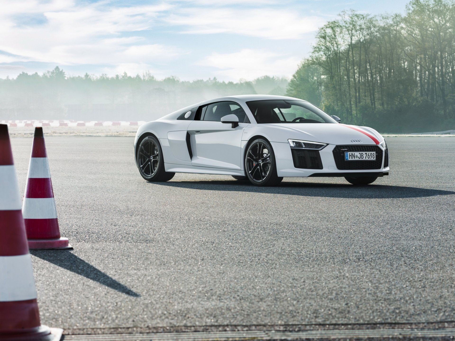 White Audi R8 V10 on an asphalt course near cones with a misty treeline — 4K Ultra HD PC desktop wallpaper.
